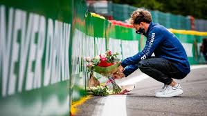 Pierre Gasly lays flowers at the spot his roommate passed away in a tragic accident