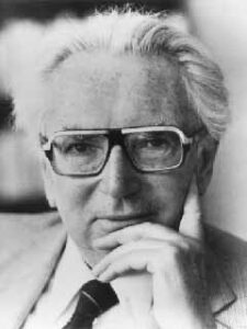 Black and white image of VIktor Frankl looking into camera