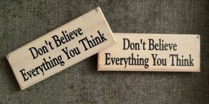 Plaques saying Don't Believe Everything You Think reminder for women and mothers
