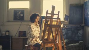 Woman painting to represent finding your passion or growing it