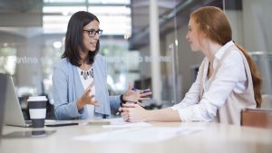 Two women sitting in an office