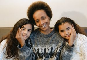Mom with daughters to symbolize deconstructing gendered messages