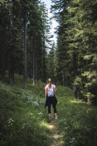 Woman walking in the forest