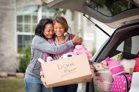 Empty-nester mom helping daughter unpack at college