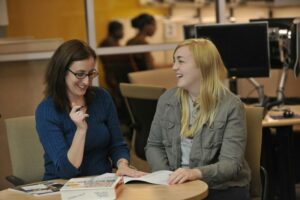 Young woman speaking to a career coach