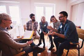 Image of people sitting around a table