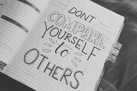 Notebook page that says 'don't compare yourself to others' to represent comparison as connection
