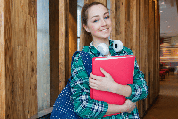 photo of female college student to represent managing money in college' up to camera