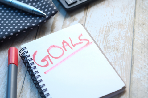Photo of notebook with 'Goals' written on the front page in red